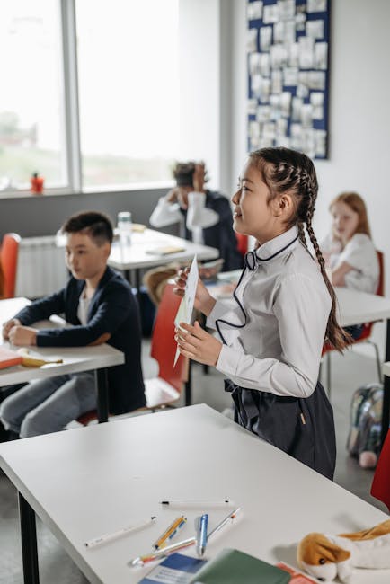 Young students attentively participating in a classroom activity, fostering learning and education.